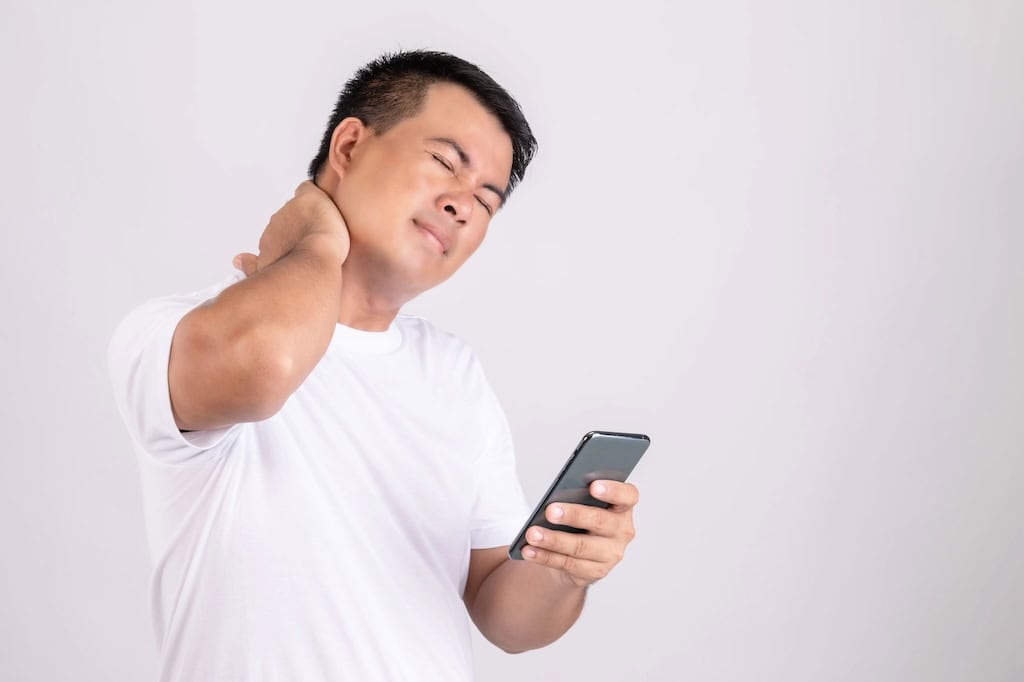Man suffering sore neck and headache