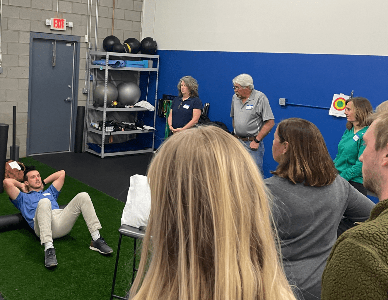 Dr. Jake showing attendees how to foam roll